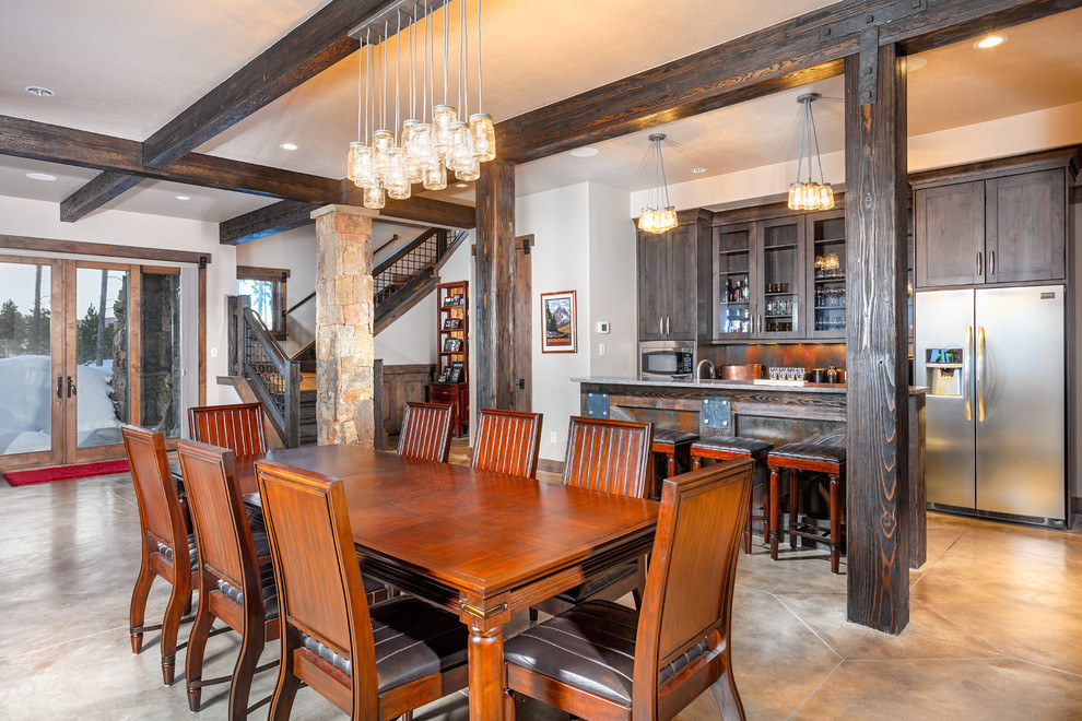 Kitchen/dining room combo - rustic kitchen/dining room combo idea in Denver with white walls