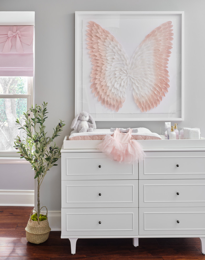 Shadylane Nursery- Design & Furnishings - Our team was thrilled to design and furnish a beautiful blush nursery for baby Sloan's imminent arrival.  The large scale rose wallpaper was the inspiration for the room's feminine design.  Pale gray walls provide a quiet backdrop to the patterned wallpaper.  Blush window treatments, crisp white furniture, and beautifully detailed children's artwork finish the space.  The natural light flooding through the windows provides a tranquil space for a newborn baby.
