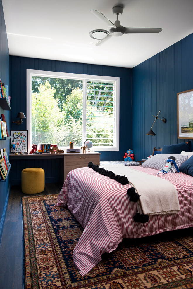 Photo of an eclectic kids' room for boys in Melbourne with black walls, dark hardwood floors and brown floor.