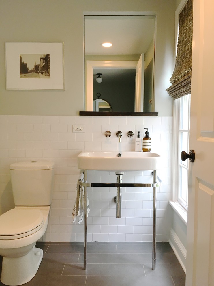 Photo of a mid-sized country 3/4 bathroom in New York with a two-piece toilet, beige walls, a console sink, white tile, subway tile, open cabinets, porcelain floors and grey floor.