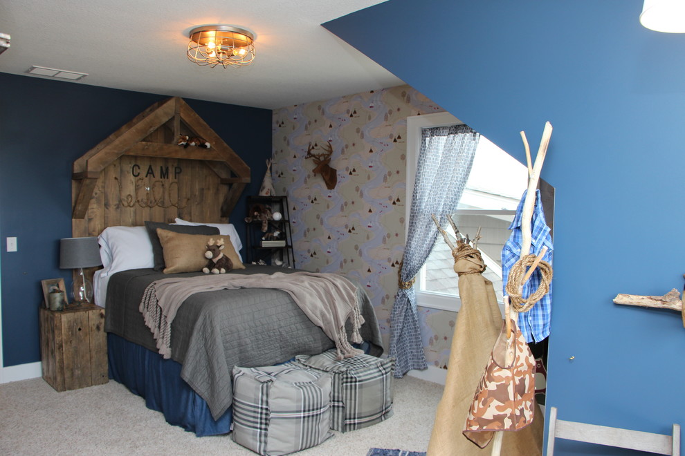 This is an example of a mid-sized country kids' bedroom for kids 4-10 years old and boys in Indianapolis with blue walls and carpet.