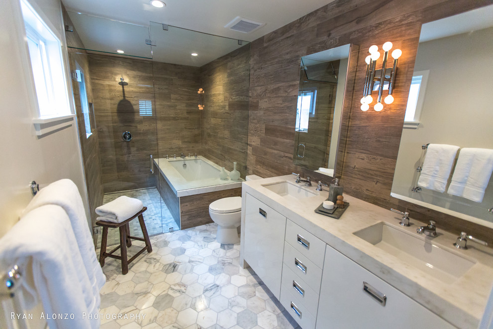 Design ideas for a large contemporary master bathroom in Orange County with an undermount sink, flat-panel cabinets, white cabinets, marble benchtops, an undermount tub, a curbless shower, a one-piece toilet, brown tile, porcelain tile and marble floors.