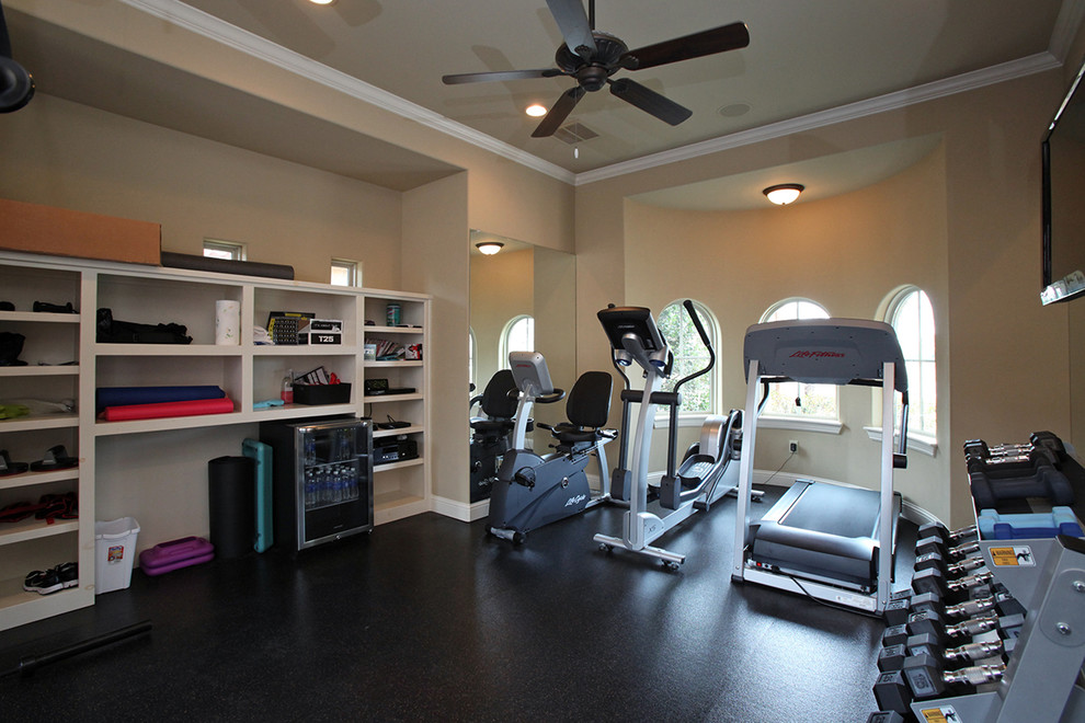 Large eclectic multipurpose gym in Dallas with beige walls, cork floors and black floor.