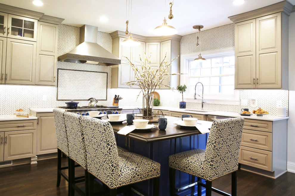 Enclosed kitchen - large transitional l-shaped dark wood floor and brown floor enclosed kitchen idea with raised-panel cabinets, white backsplash, ceramic backsplash, stainless steel appliances and an island