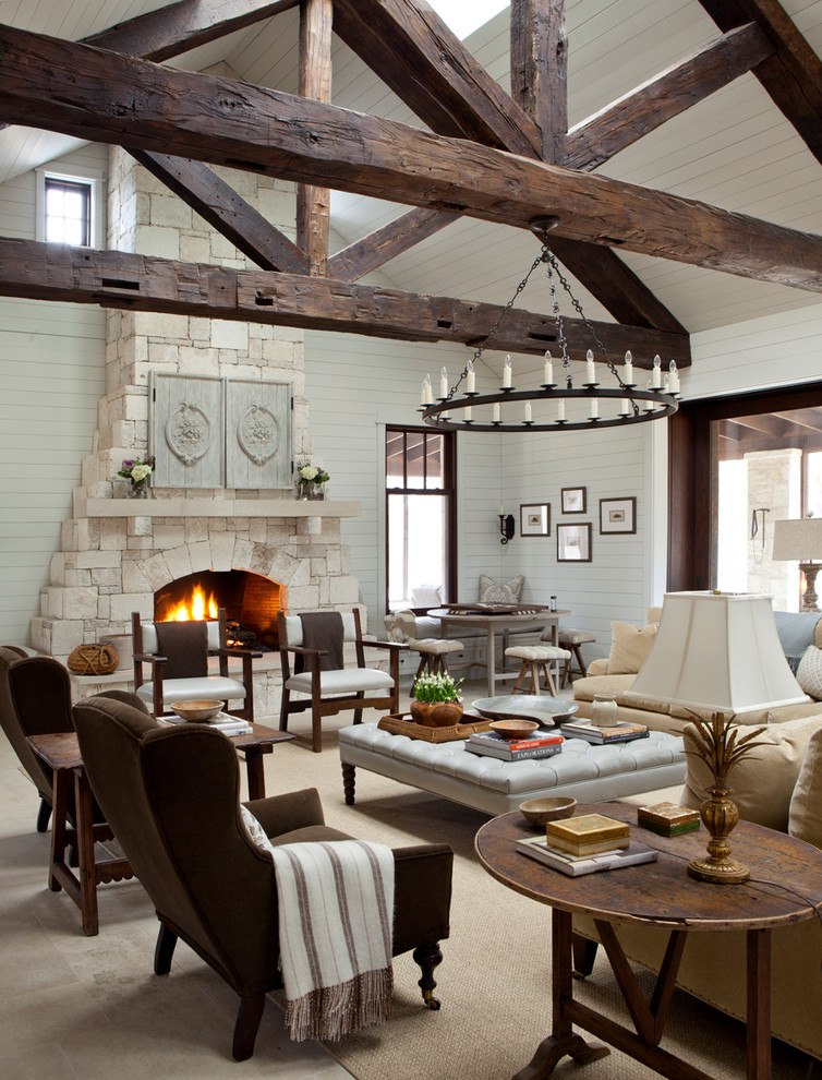 Example of a cottage open concept living room design in Austin with white walls, a standard fireplace, a stone fireplace and no tv