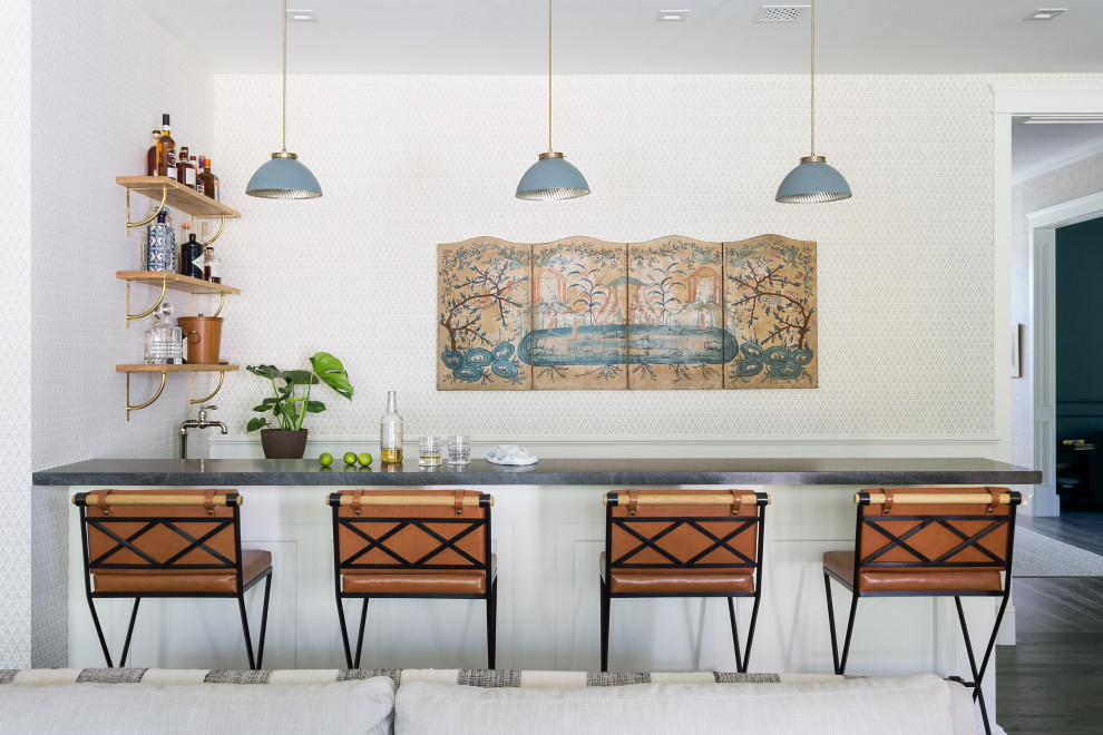 Photo of a mid-sized eclectic seated home bar in Los Angeles with open cabinets, light wood cabinets, soapstone benchtops, stone slab splashback, medium hardwood floors, brown floor and grey benchtop.