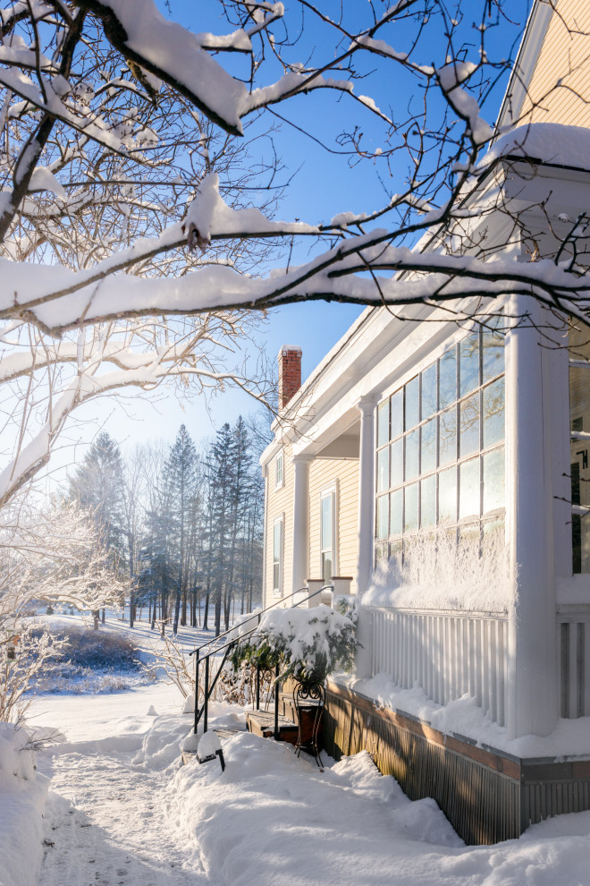 Example of a cottage exterior home design in Boston