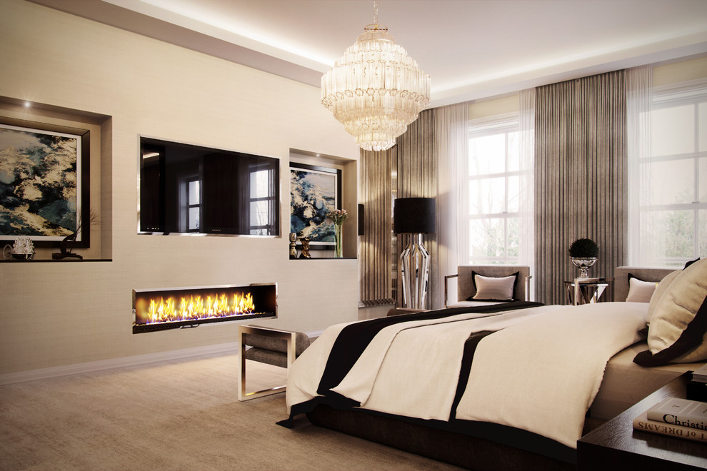 Photo of a contemporary master bedroom in West Midlands with beige walls, carpet, a ribbon fireplace and beige floor.