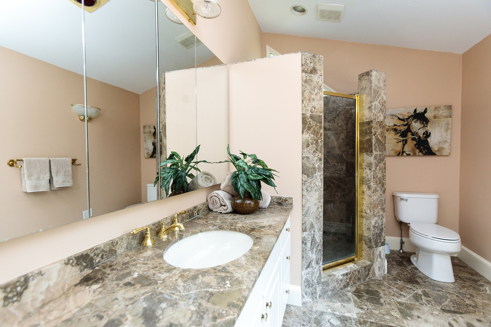 Expansive traditional master bathroom in Boston with flat-panel cabinets, white cabinets, a corner shower, a two-piece toilet, beige walls, marble floors, a drop-in sink, marble benchtops, multi-coloured floor, a hinged shower door and multi-coloured benchtops.