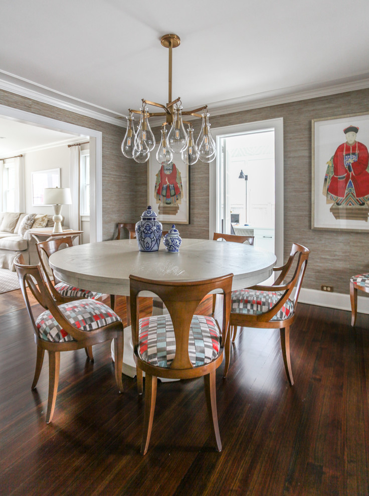 This is an example of a transitional dining room in New York with grey walls, dark hardwood floors and brown floor.
