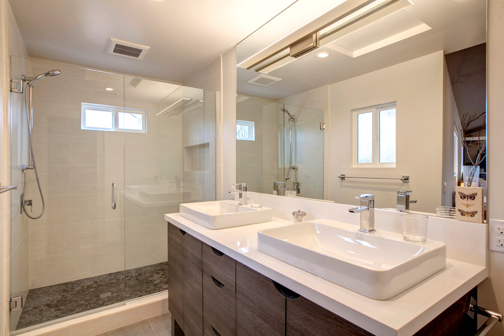 This is an example of a mid-sized eclectic master bathroom in San Diego with a vessel sink, flat-panel cabinets, distressed cabinets, engineered quartz benchtops, an open shower, white walls and light hardwood floors.