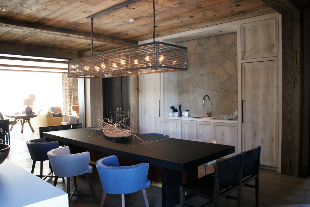 Kitchen/dining room combo - mid-sized rustic dark wood floor kitchen/dining room combo idea in Denver with brown walls and no fireplace