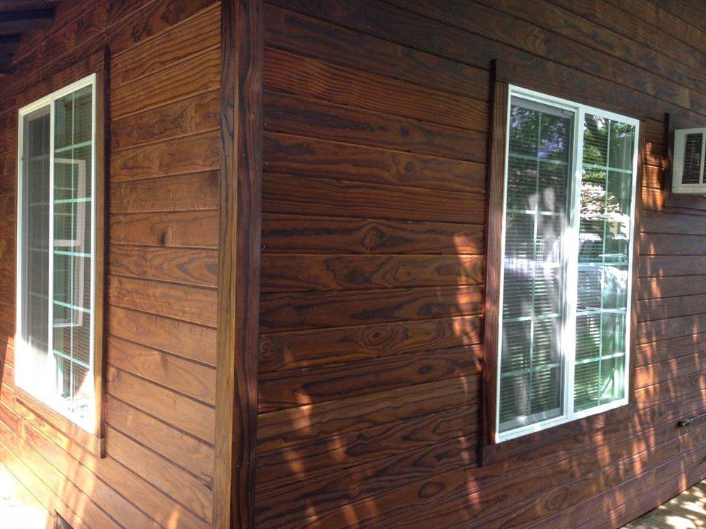 Photo of a mid-sized country brown house exterior in San Diego with wood siding.