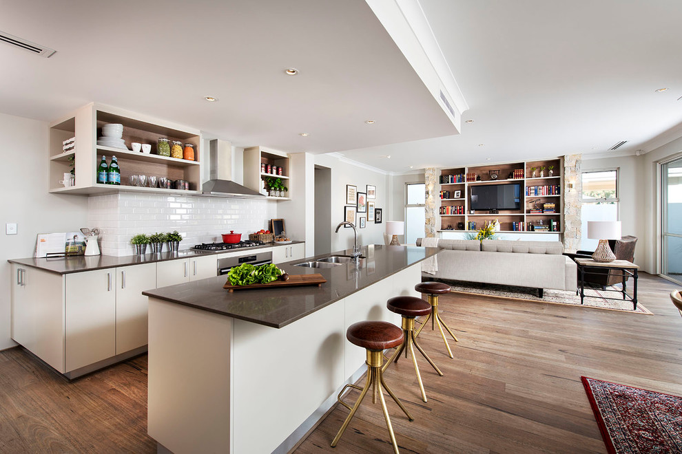 Inspiration for a large transitional open plan kitchen in Perth with a double-bowl sink, flat-panel cabinets, white cabinets, white splashback, subway tile splashback and with island.