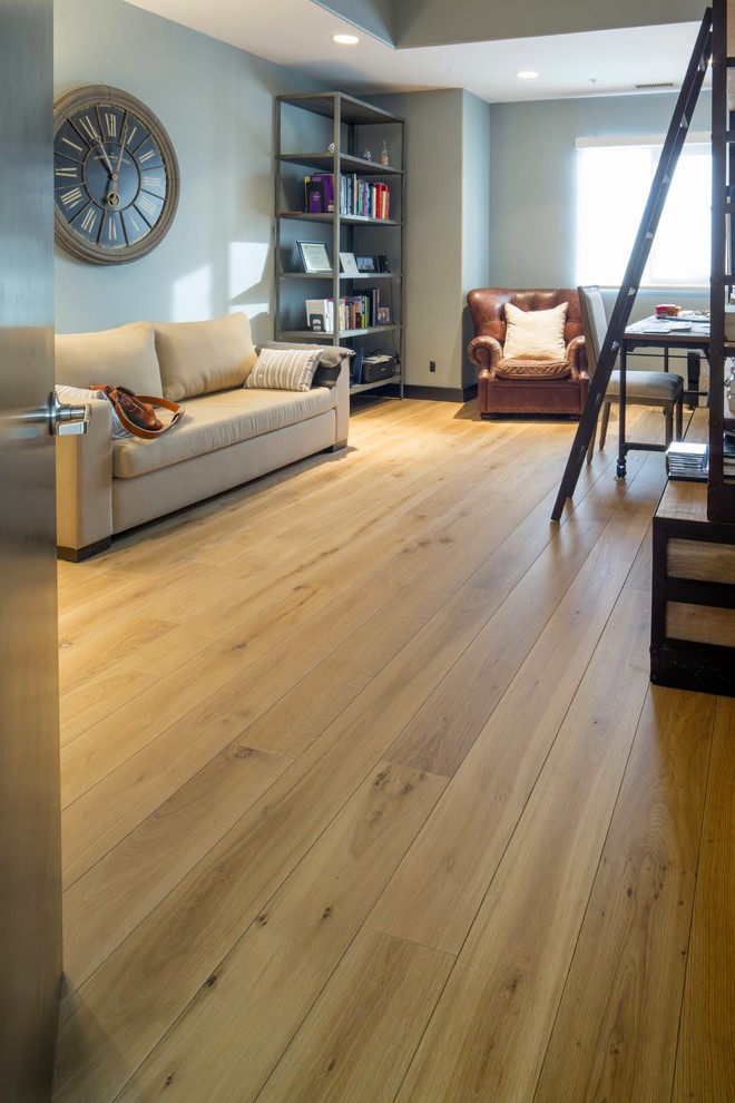 Example of a transitional light wood floor home design design in Calgary
