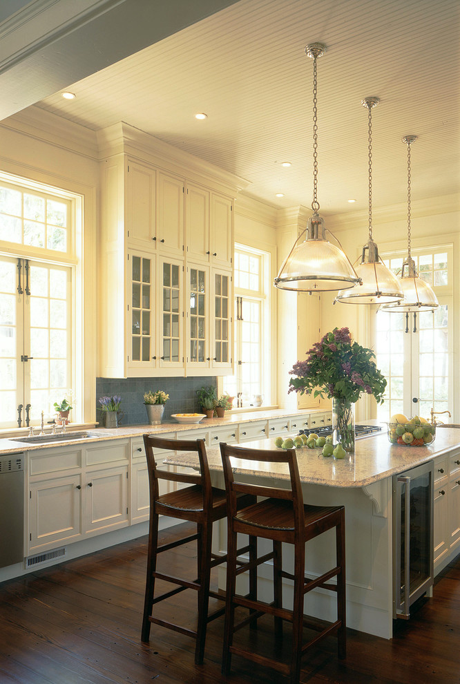 Inspiration for a large traditional eat-in kitchen in Charleston with recessed-panel cabinets, white cabinets, marble benchtops, dark hardwood floors and with island.