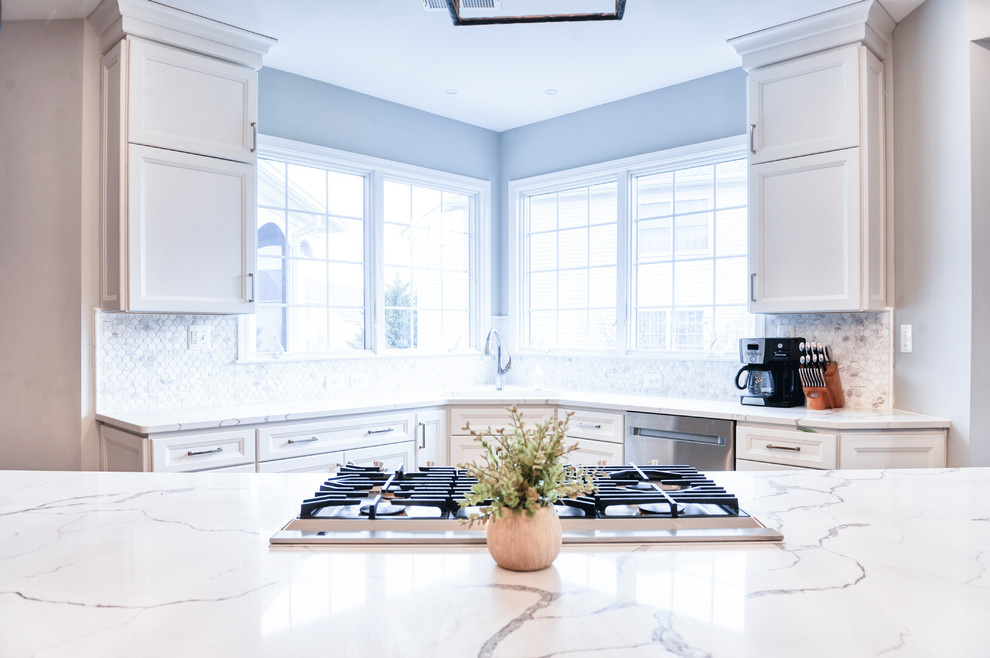 Example of a huge transitional galley brown floor and light wood floor eat-in kitchen design in DC Metro with an undermount sink, beaded inset cabinets, white cabinets, quartzite countertops, white backsplash, marble backsplash, stainless steel appliances, an island and white countertops