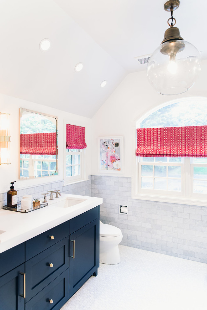 Japanese bathtub - mid-sized transitional master blue tile and marble tile mosaic tile floor and blue floor japanese bathtub idea in Baltimore with recessed-panel cabinets, blue cabinets, a one-piece toilet, white walls, a drop-in sink, marble countertops and a hinged shower door