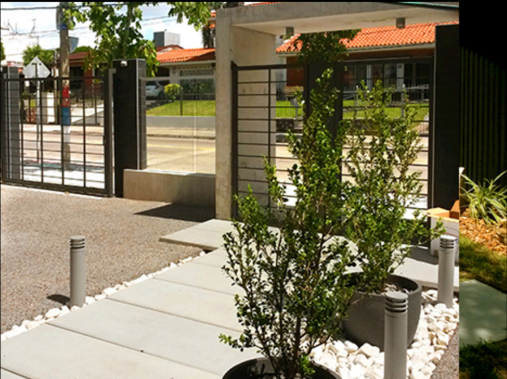 Inspiration for a large contemporary front door remodel with gray walls and a black front door