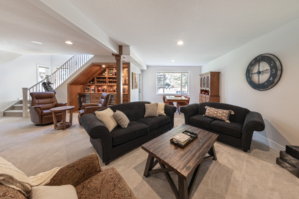 Mid-sized cottage walk-out carpeted and beige floor basement game room photo in Edmonton with white walls, a corner fireplace and a brick fireplace