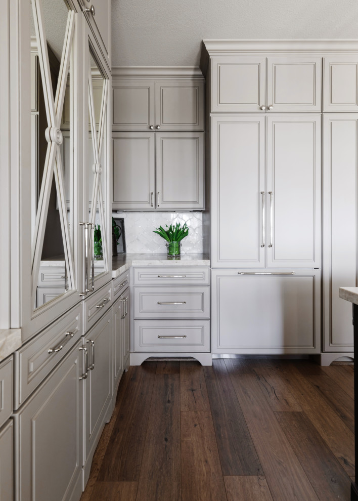 Example of a transitional medium tone wood floor kitchen design in Houston with a farmhouse sink, flat-panel cabinets, gray cabinets, quartzite countertops, stainless steel appliances, an island and white countertops