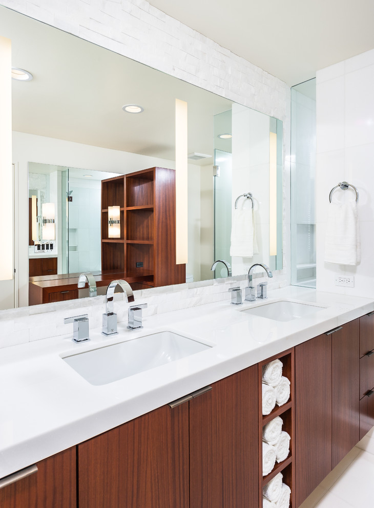 Large midcentury master bathroom in Los Angeles with flat-panel cabinets, medium wood cabinets, a corner shower, a one-piece toilet, white tile, stone tile, white walls, marble floors, an undermount sink and engineered quartz benchtops.