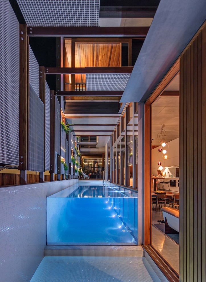Design ideas for a mid-sized contemporary rectangular aboveground pool in Sydney.