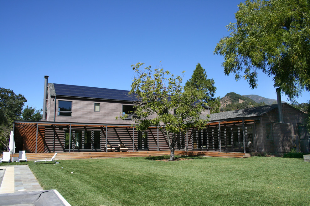 This is an example of a large modern two-storey brown exterior in San Francisco with wood siding.