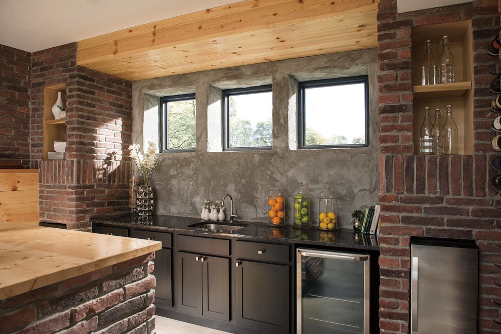 Basement - large rustic look-out light wood floor and beige floor basement idea in Omaha with brown walls and no fireplace