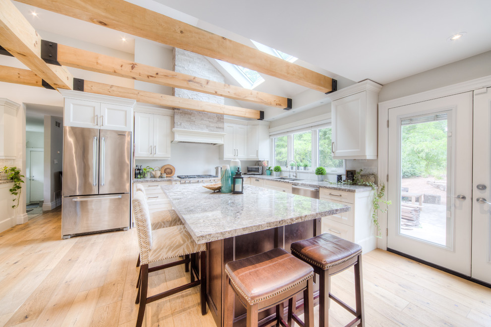 Enclosed kitchen - large transitional l-shaped light wood floor and beige floor enclosed kitchen idea in Toronto with a double-bowl sink, recessed-panel cabinets, white cabinets, granite countertops, stainless steel appliances, an island and gray countertops