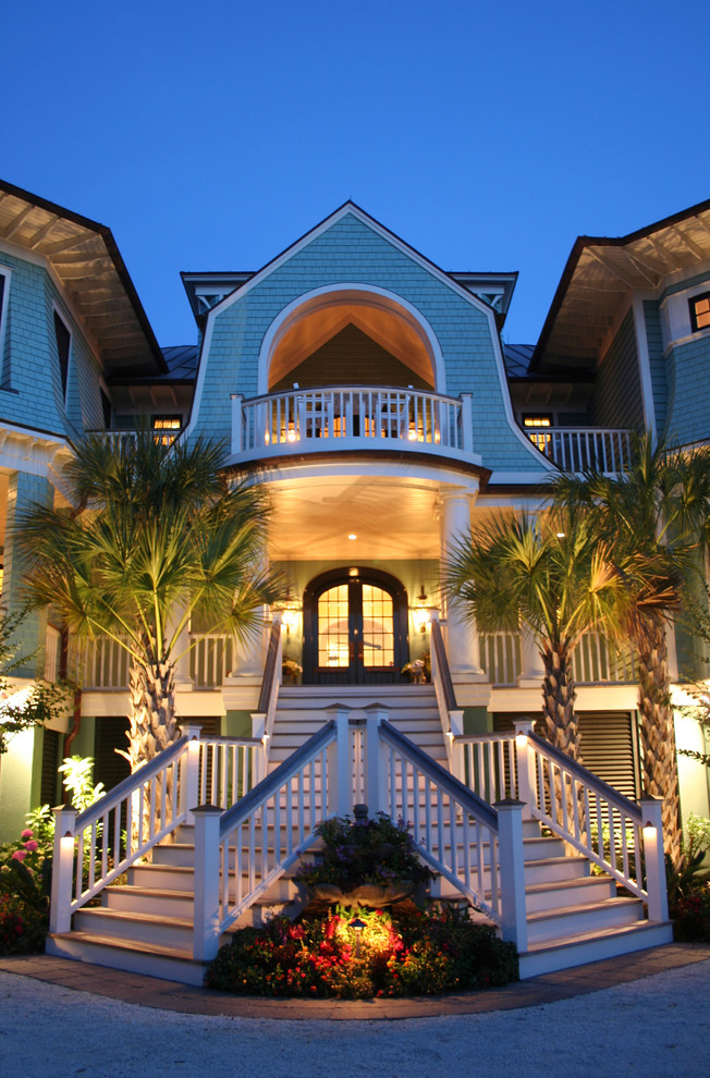 Beach style entryway in Charleston with a double front door and a dark wood front door.