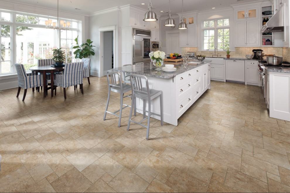 Inspiration for a large transitional l-shaped travertine floor eat-in kitchen remodel in Indianapolis with an undermount sink, shaker cabinets, white cabinets, granite countertops, beige backsplash, stone tile backsplash, stainless steel appliances and an island