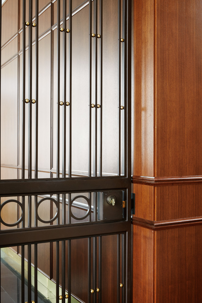 Foyer - huge transitional foyer idea in Chicago with a metal front door