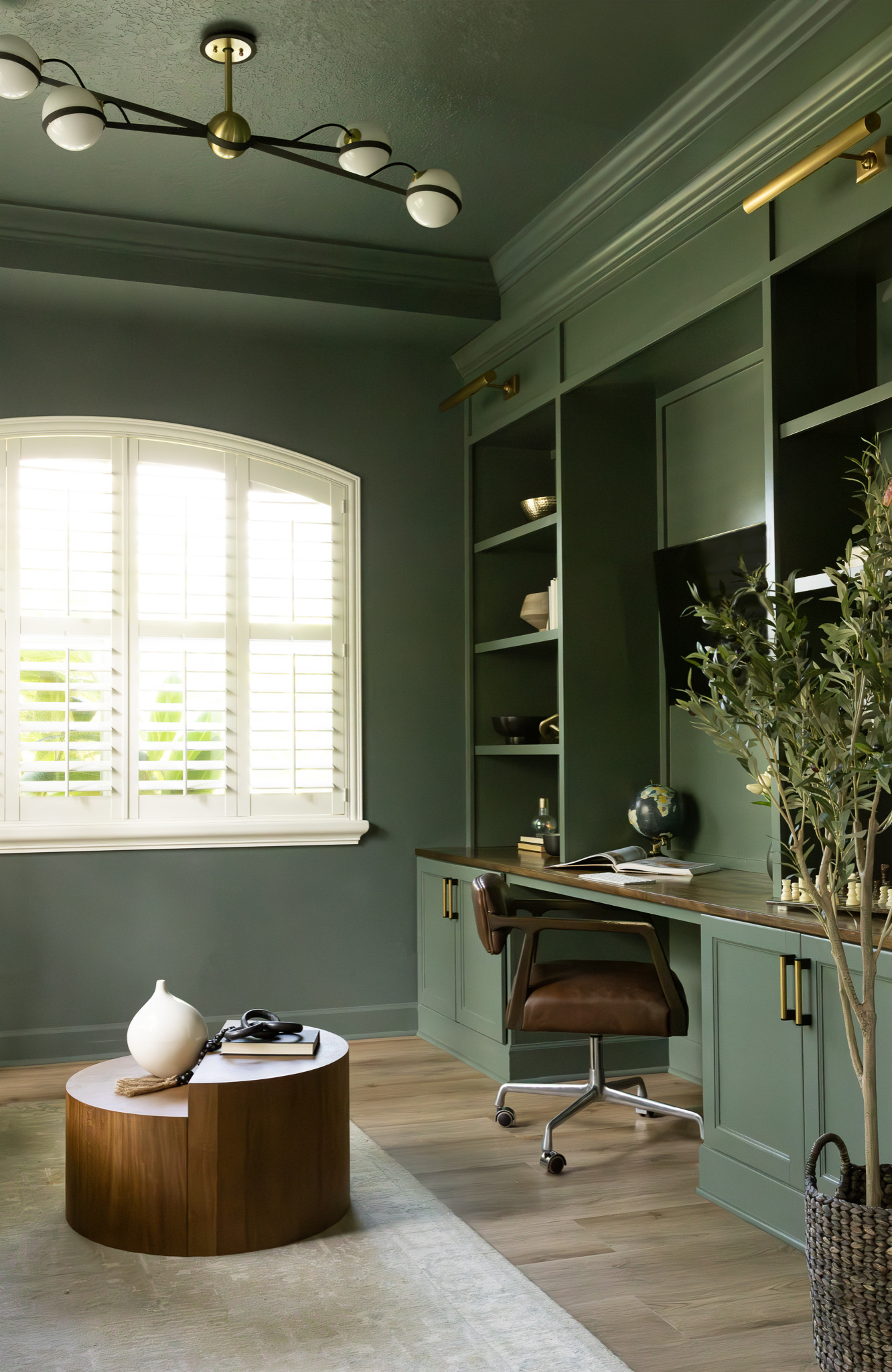 Inspiration for a transitional home office remodel in Tampa with green walls