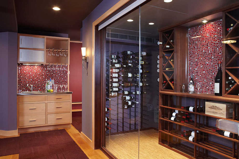 This is an example of a large transitional wine cellar in Other with light hardwood floors, diamond bins and brown floor.
