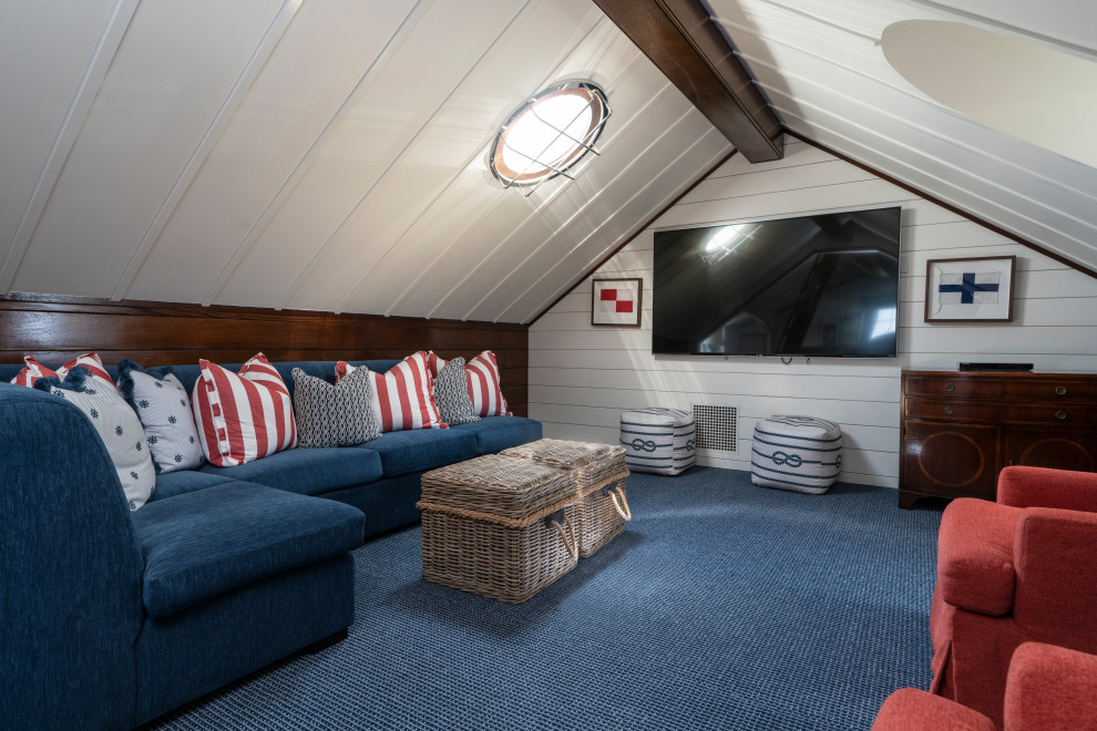 Bild på ett maritimt könsneutralt tonårsrum kombinerat med lekrum, med vita väggar, heltäckningsmatta och blått golv
