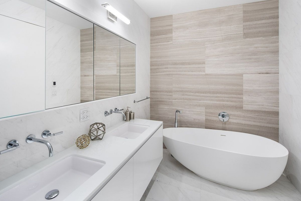 Inspiration for a mid-sized contemporary master bathroom in New York with glass-front cabinets, white cabinets, white tile, marble, white walls, marble floors, marble benchtops, white benchtops, a double vanity and a floating vanity.