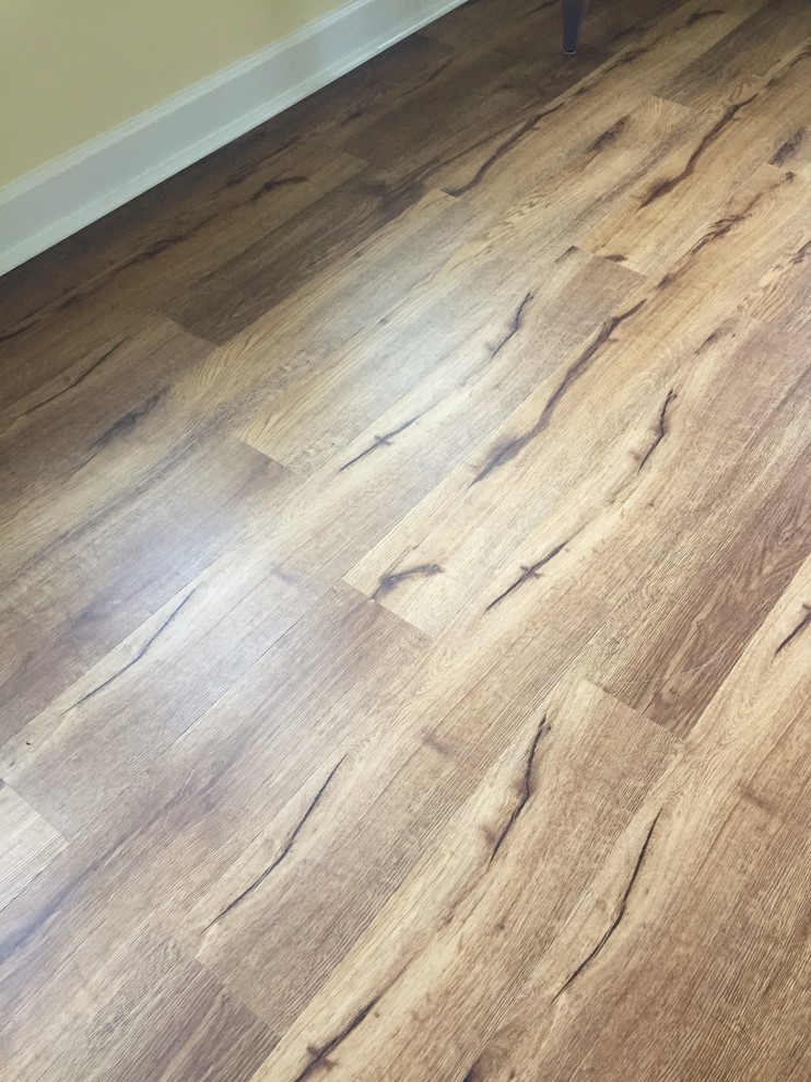 Inspiration for a large timeless loft-style vinyl floor home design remodel with yellow walls