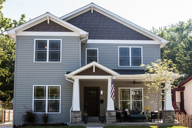 Inspiration for a traditional blue exterior in St Louis with mixed siding.