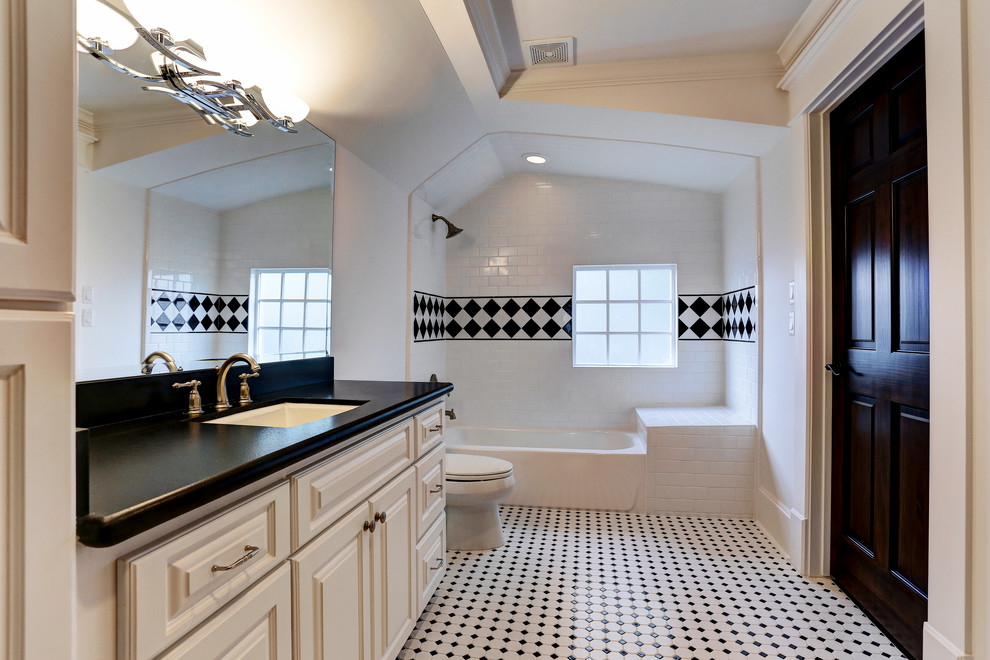 Inspiration for a mid-sized traditional kids bathroom in Houston with an undermount sink, raised-panel cabinets, white cabinets, tile benchtops, an alcove tub, a shower/bathtub combo, a one-piece toilet, yellow tile, ceramic tile, white walls and ceramic floors.