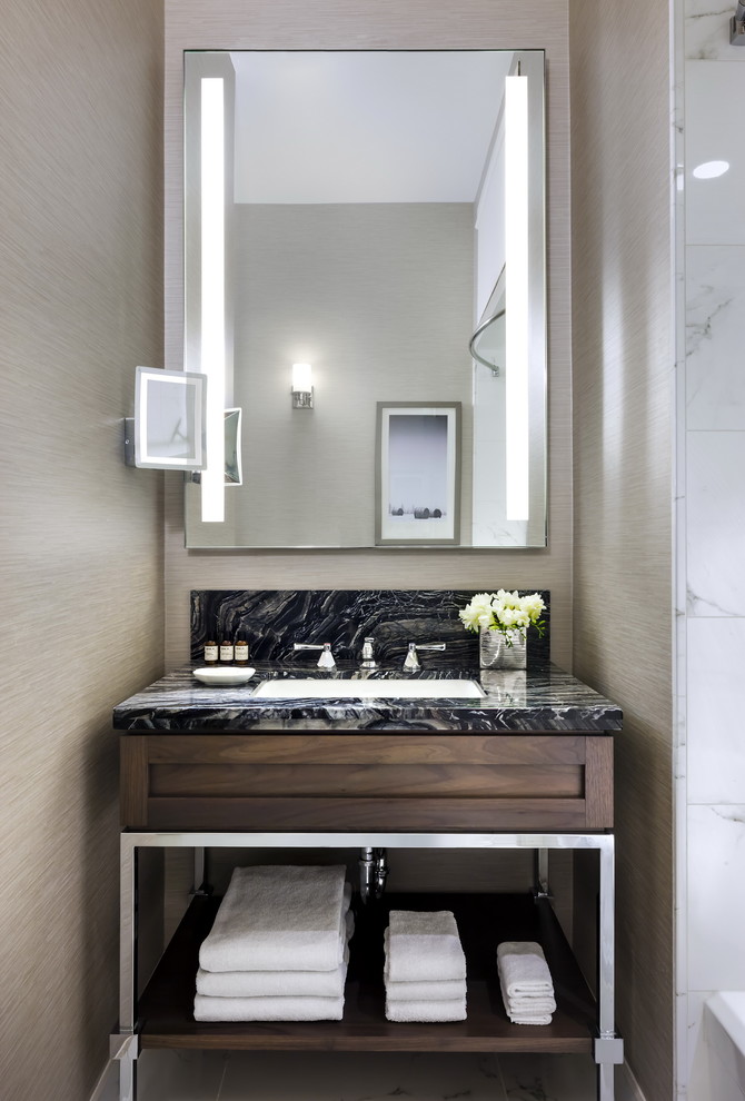 Photo of a small transitional bathroom in Calgary with an undermount sink, open cabinets, dark wood cabinets, soapstone benchtops and grey walls.