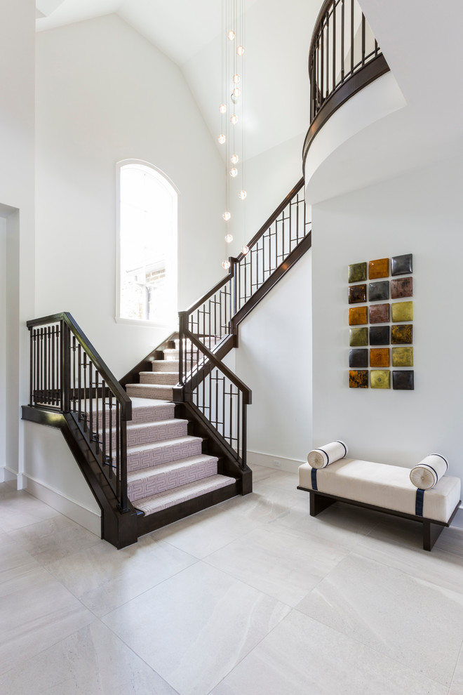 This is an example of a contemporary foyer in Houston with white walls and porcelain floors.