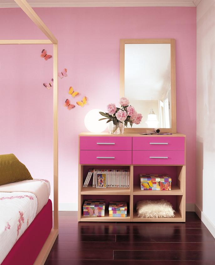 Photo of a large contemporary kids' bedroom for kids 4-10 years old and girls in Dusseldorf with pink walls, dark hardwood floors and purple floor.