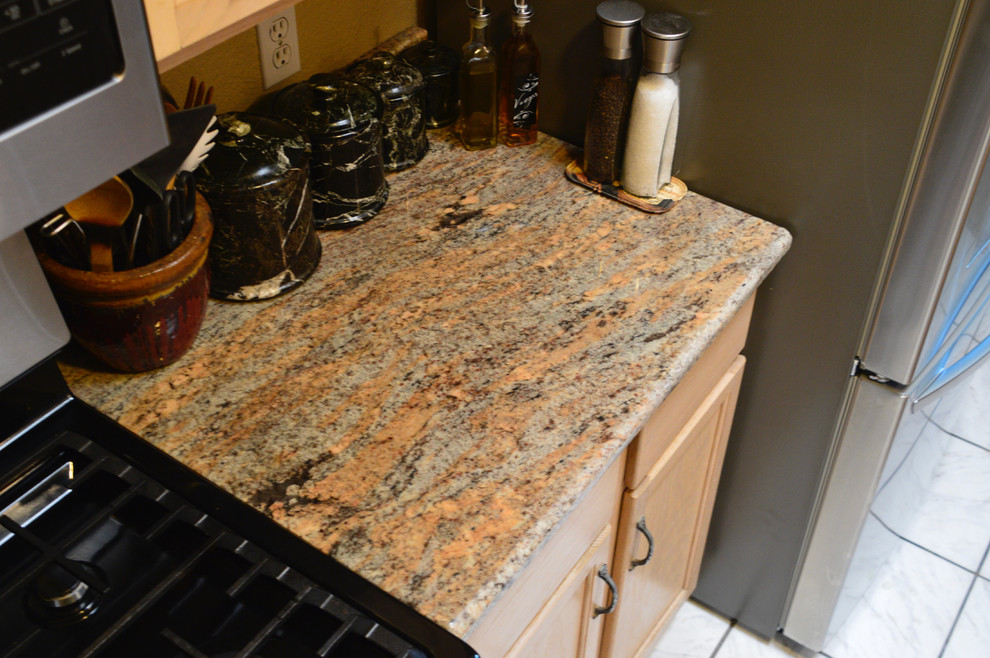Inspiration for a small rustic single-wall ceramic tile enclosed kitchen remodel in Albuquerque with an undermount sink, granite countertops and no island