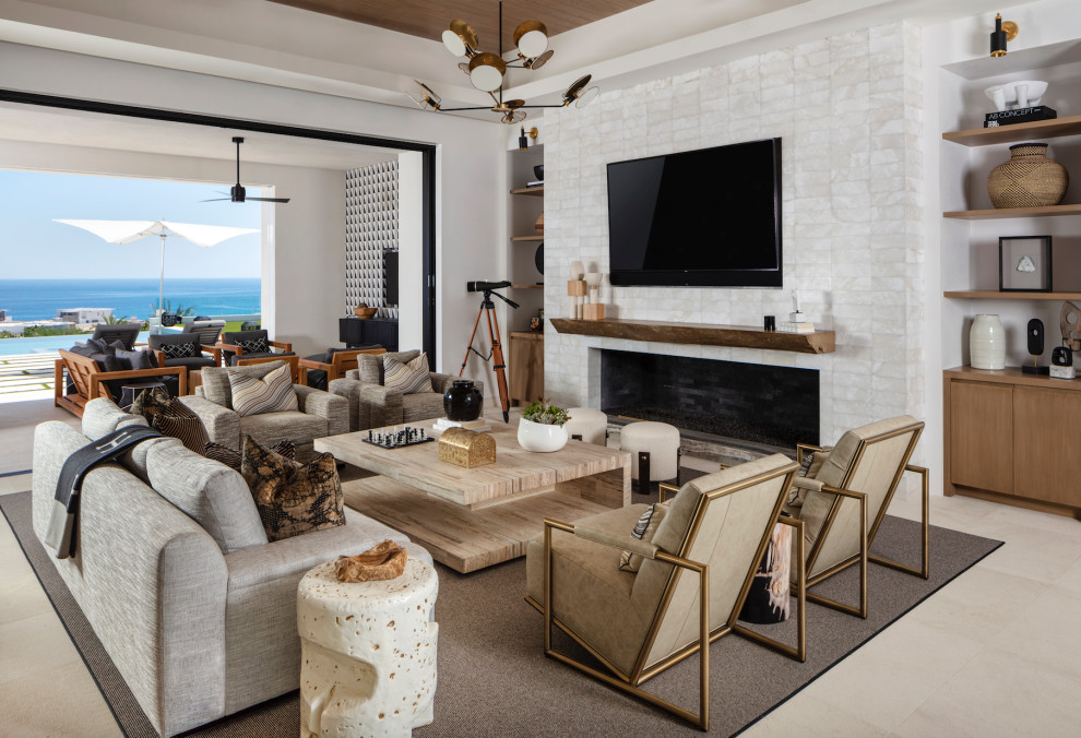 Contemporary open concept living room in Orange County with white walls, a standard fireplace, a tile fireplace surround, a wall-mounted tv, beige floor, recessed and wood.
