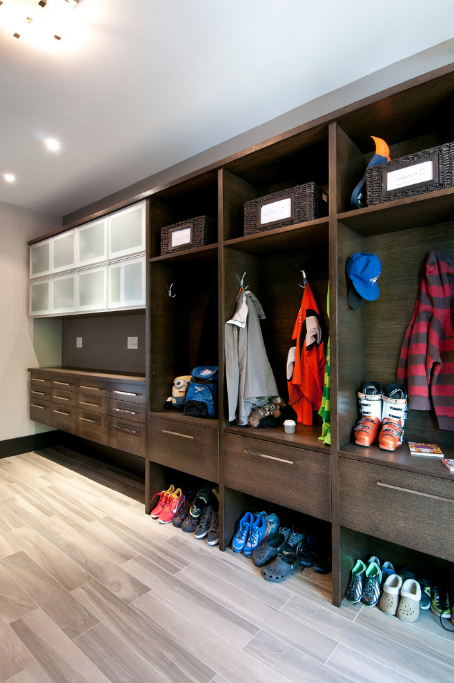 Design ideas for a contemporary mudroom in Toronto with grey walls and light hardwood floors.