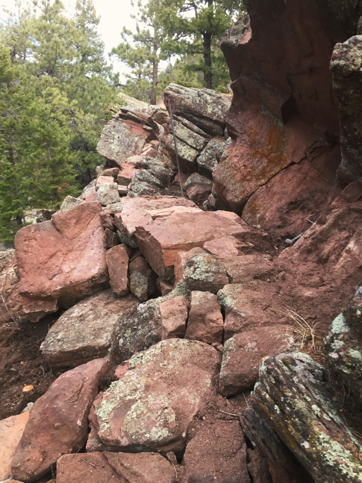 Design ideas for a huge rustic hillside retaining wall landscape in Denver.