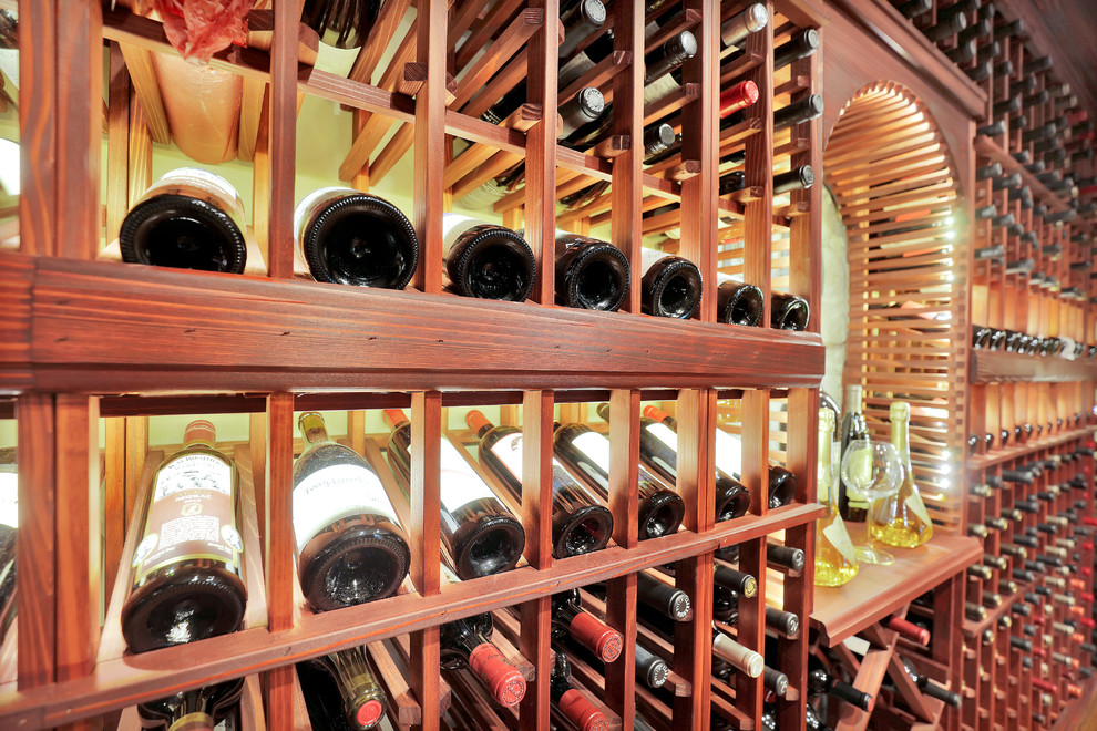 Inspiration for an expansive transitional wine cellar in Richmond with medium hardwood floors and display racks.