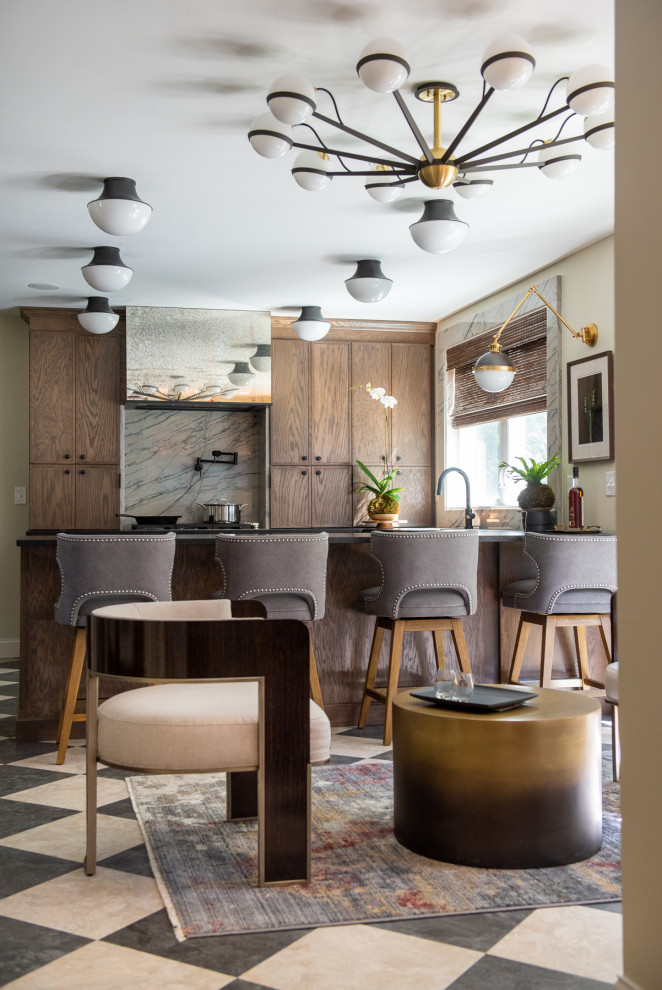 Inspiration for a mid-sized transitional u-shaped porcelain tile and multicolored floor eat-in kitchen remodel in St Louis with shaker cabinets, medium tone wood cabinets, granite countertops, white backsplash, marble backsplash, stainless steel appliances, a peninsula and black countertops