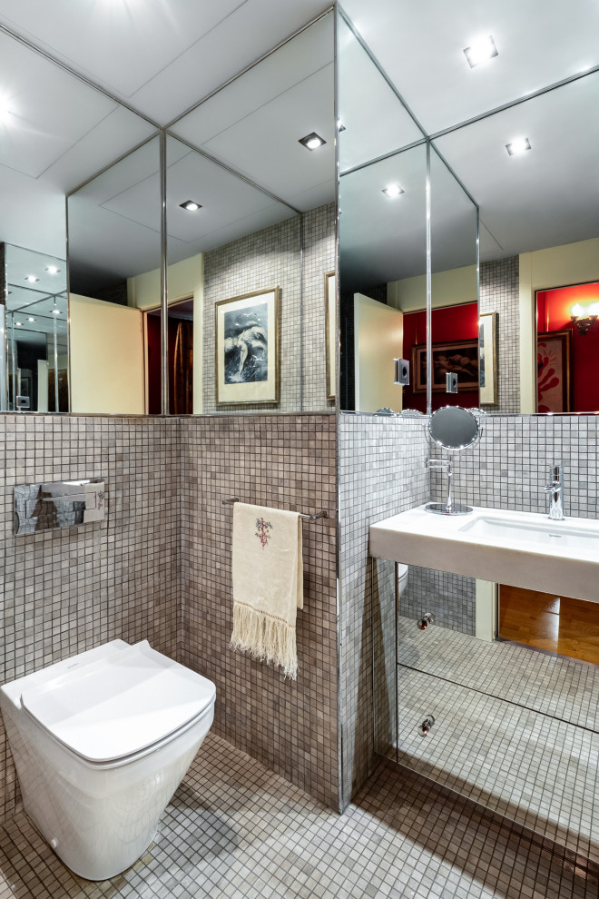 Contemporary bathroom in Barcelona with flat-panel cabinets, grey walls, mosaic tile floors, an undermount sink, grey floor, a single vanity and a built-in vanity.